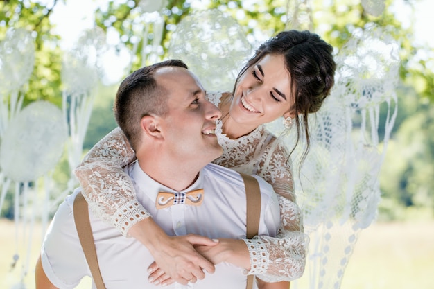 Closeup portrait of a young happy newlywed couple