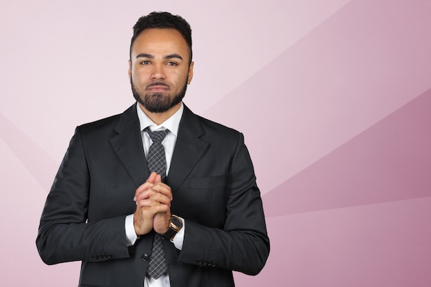 Closeup portrait of young man businessman gesturing pretty please, begging