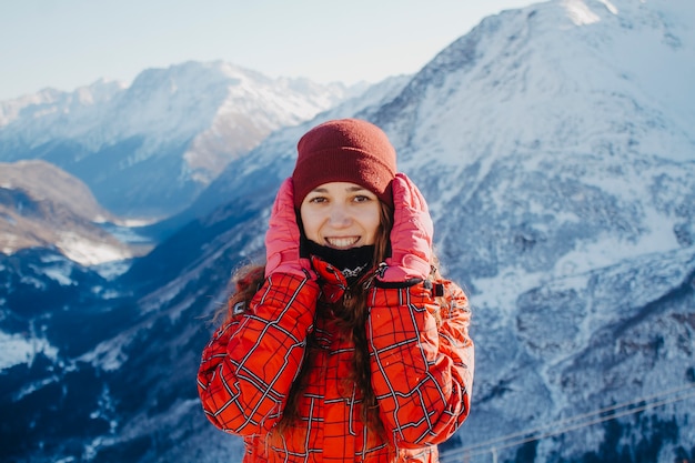 Closeup portrait of a young woman in the mountains.