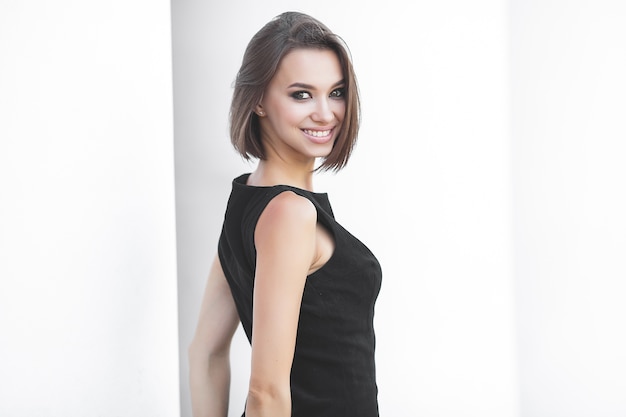 Closeup portrait of young woman on neutral background. Beautiful female outdoors.