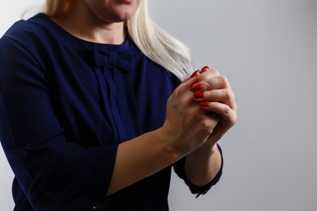 Closeup portrait of a young woman praying