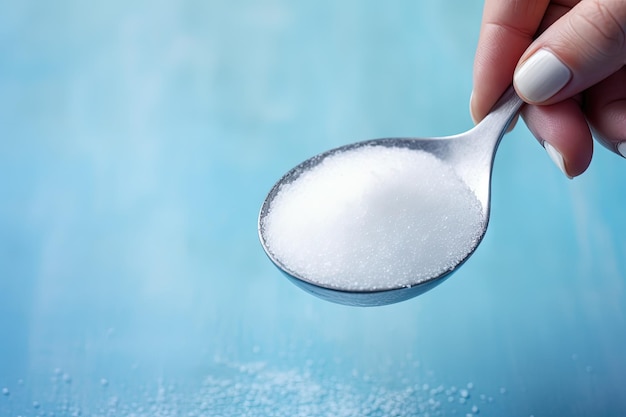 Photo closeup pov shot of a woman s hand holding a spoon with citric acid powder for kettle descaling on a