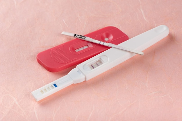closeup pregnancy test with positive pregnant
