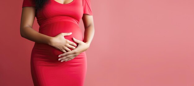 A closeup of a pregnant woman's belly showcasing the miracle of life in a studio setting