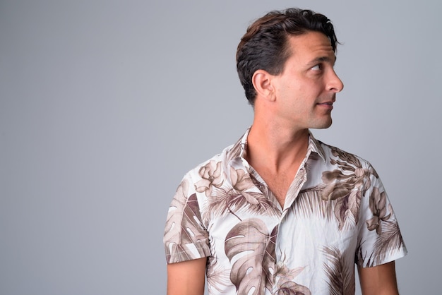 Closeup profile view of handsome Hispanic tourist man