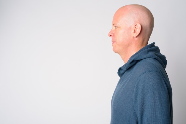 Closeup profile view of mature handsome bald man