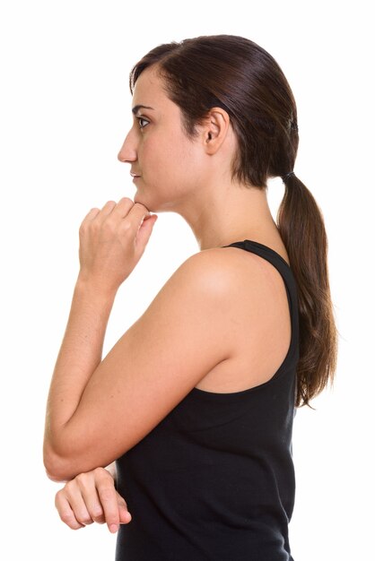 Closeup profile view of young beautiful woman thinking