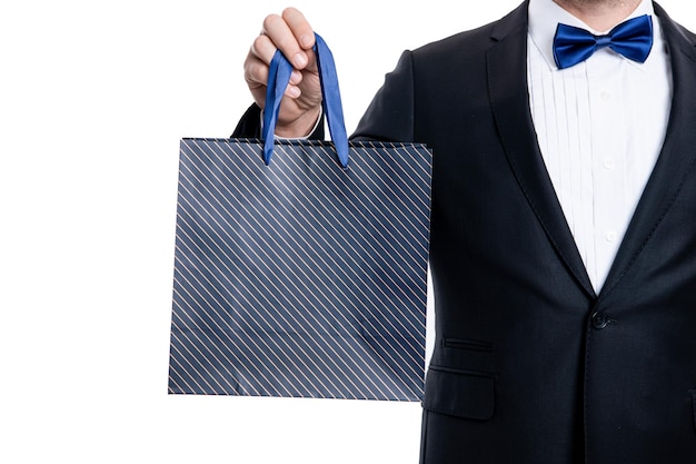Closeup purchase of shopper man on shopping sale tuxedo shopper man with shopping bag