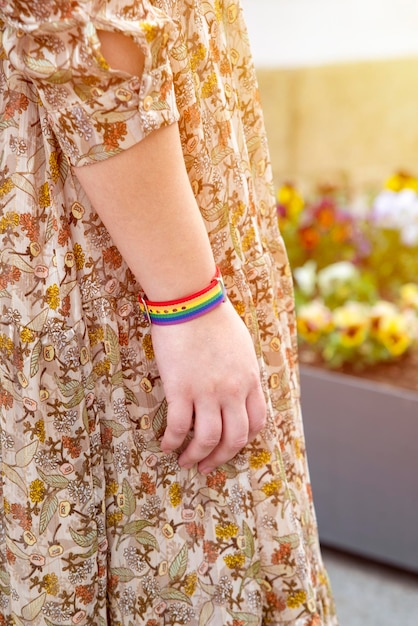 Closeup of rainbow bracelet lgtb symbol