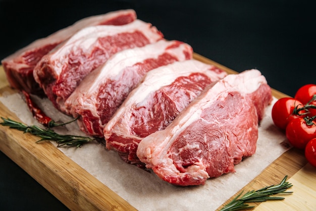 Closeup on raw veal meat tenderloins cooking
