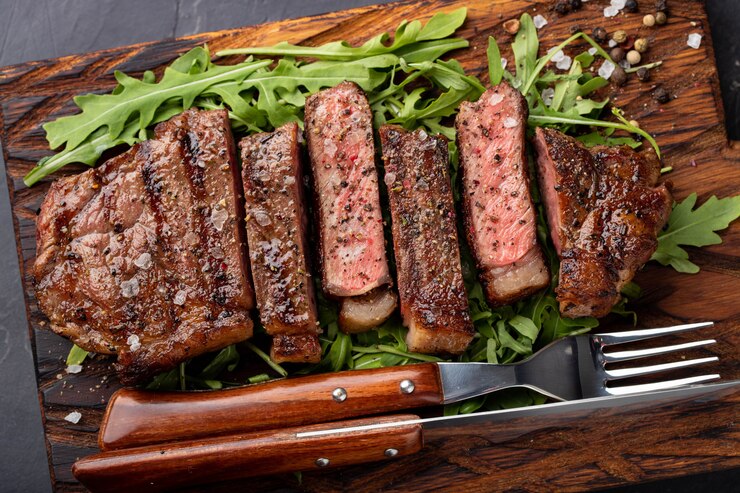 Photo closeup ready to eat steak new york.