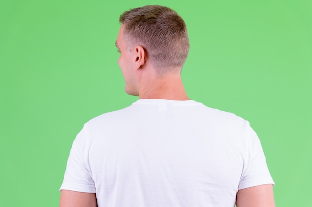 Closeup rear view of young man wearing white shirt