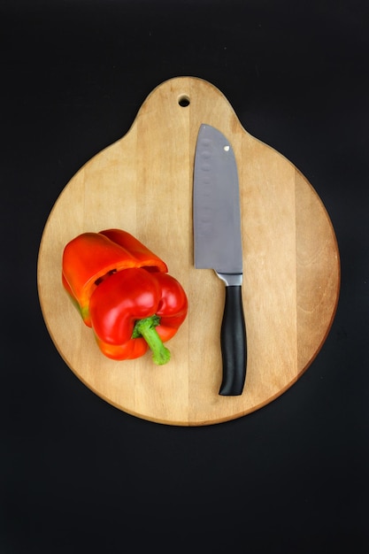 Closeup of reb bell pepper which is was cut by sharp kitchen knife