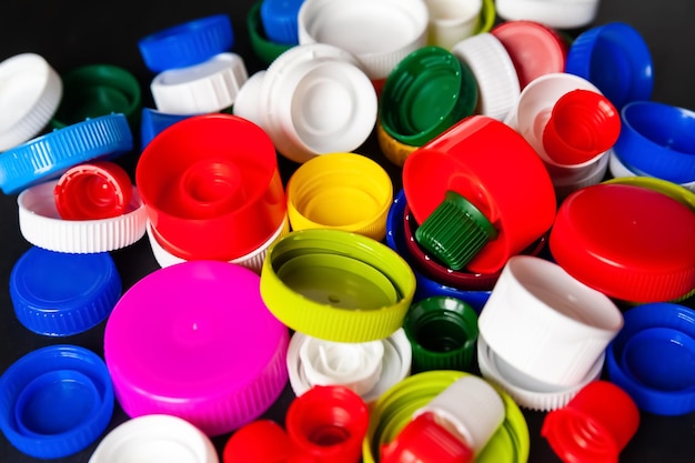 Closeup of recycled plastic bottle caps Colored PET lids Separate garbage collection