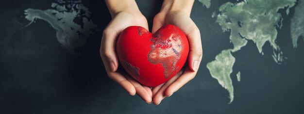 closeup of red heart in hands