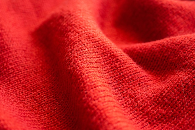 Closeup red knitted woolen fabric texture background