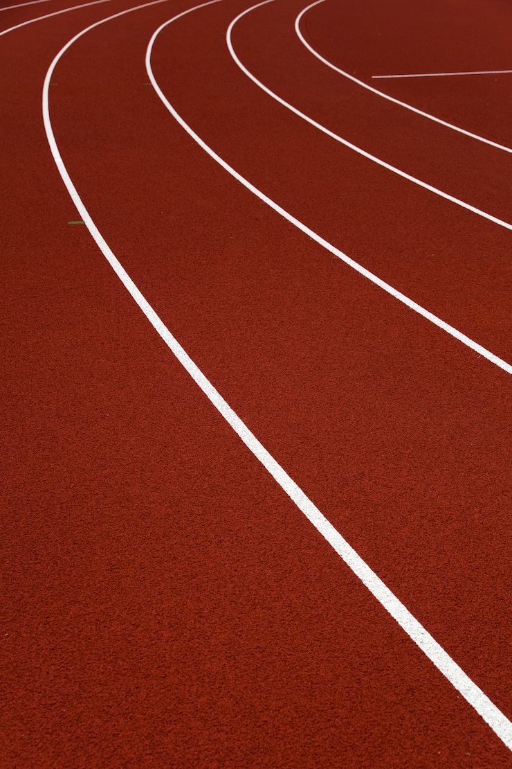 Photo closeup of the red stadium running tracks