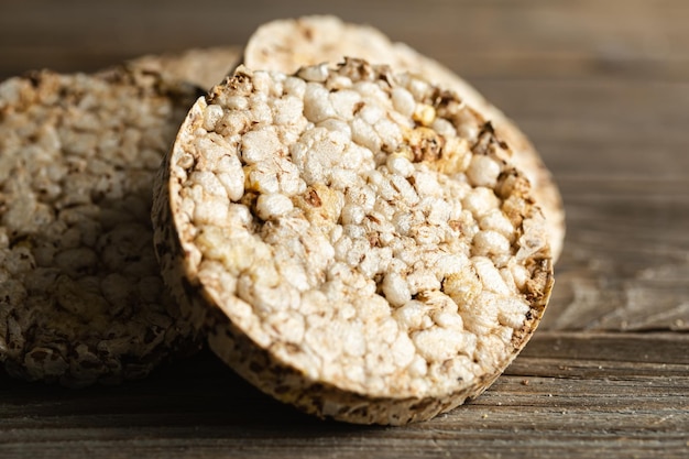 Closeup rice cakes on wooden background Tasty crisps snack with health benefits