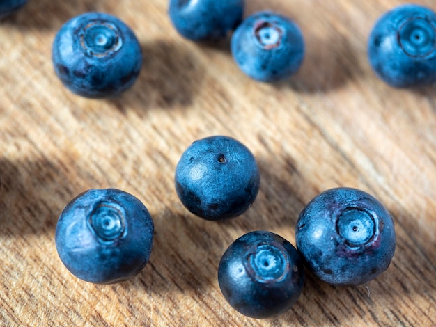 Closeup of ripe delicious blueberries on a wooden background Healthy natural products vitamins selective focus