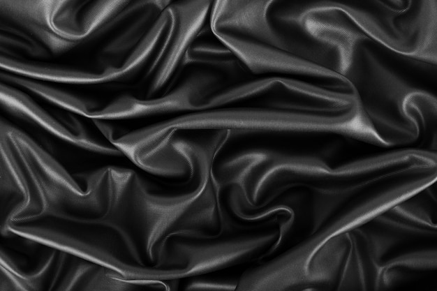 Photo closeup of rippled black silk fabric