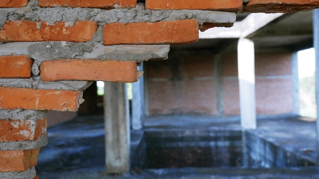 Closeup of the rubble of an industrial building collapsing into a pile of concrete and brick and the jagged debris caused by the failure of the engineers at the abandoned construction