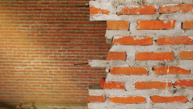 Closeup of the rubble of an industrial building collapsing into a pile of concrete and brick and the jagged debris caused by the failure of the engineers at the abandoned construction