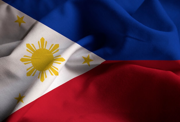 Photo closeup of ruffled philippines flag, philippines flag blowing in wind