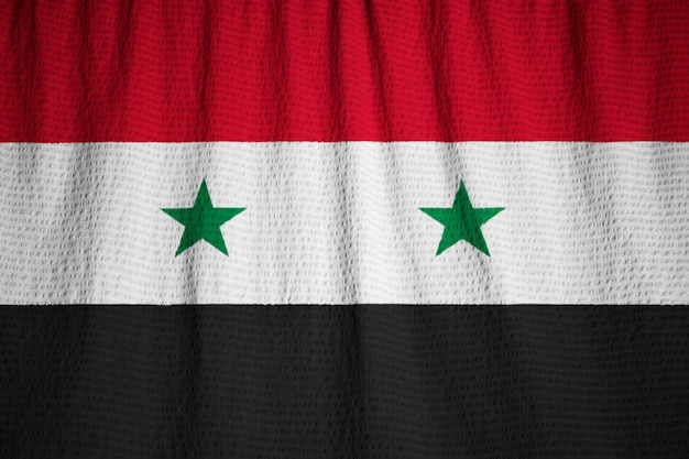 Photo closeup of ruffled syria flag, syria flag blowing in wind