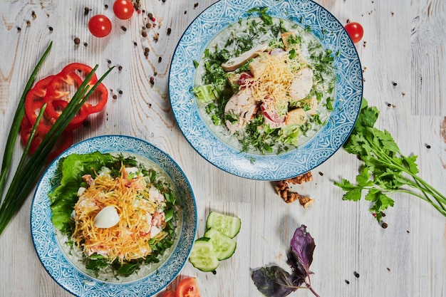 Closeup on a salad with chicken and tomato