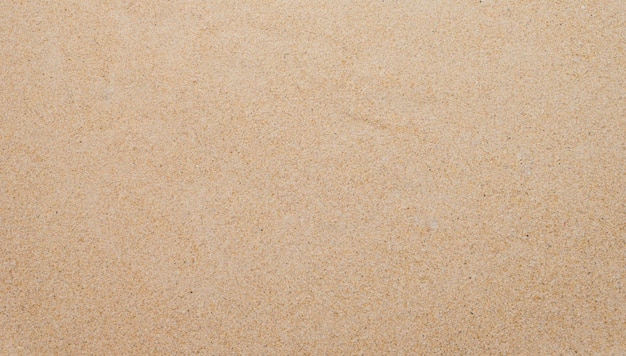 Closeup of sand background pattern of a beach in the summer