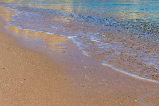 Closeup of the sand on beach and Red sea water