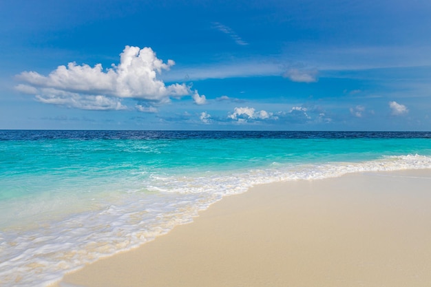 Closeup of sand waves beach blue summer sky Panoramic beach landscape Empty tropical beach sea