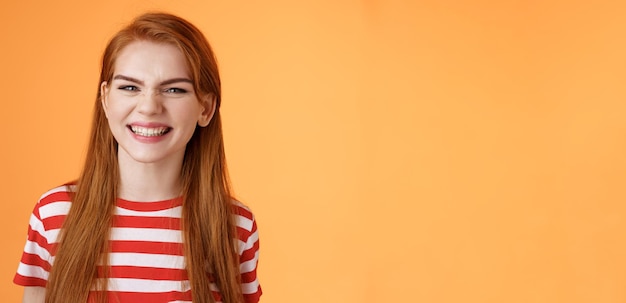 Closeup sassy goodlooking cheerful redhead sly girl smiling toothy white perfect grin satisfied dent