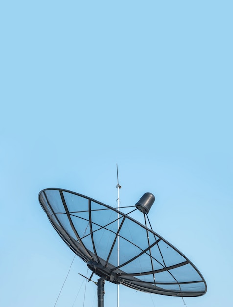 Photo closeup satellite dish on beautiful clear blue sky textured background with copy space