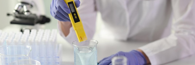 Closeup of scientist woman lab assistant making tests in laboratory pharmaceutical experiment