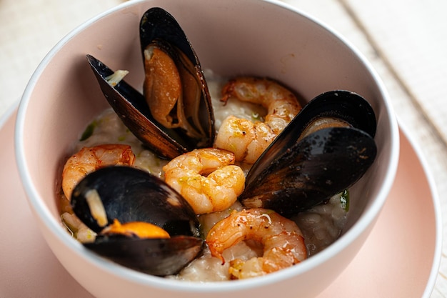 Closeup on seafood risotto with mussels and shrimp