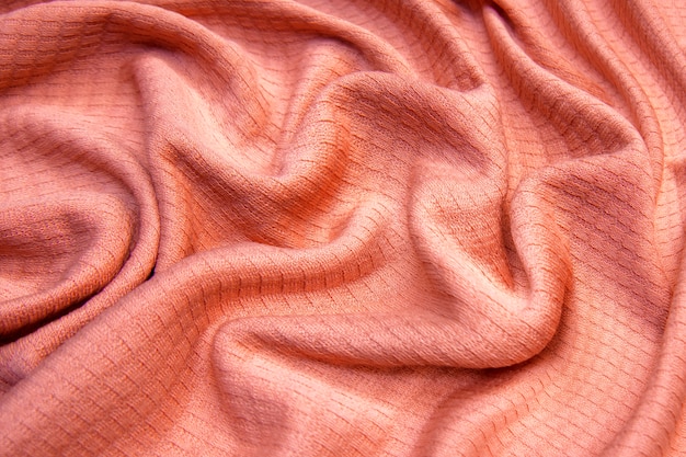 Closeup of seamless pink knitted fabric texture