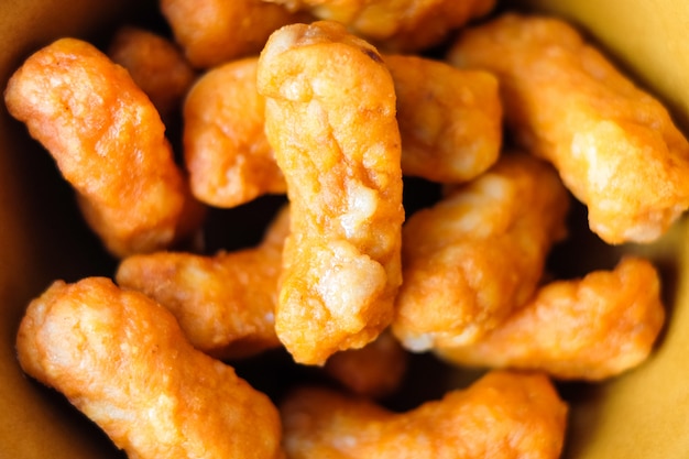 Closeup seasoned chili chicken snack in the ceramic bowl - food concept.