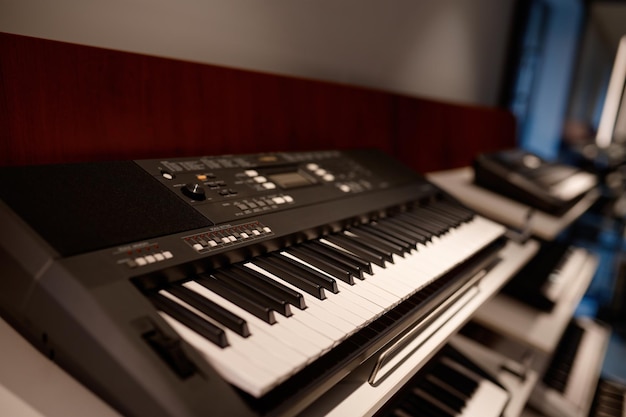 Closeup selective focus on keyboard of new electric synthesizer at shop showcase