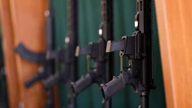 Closeup of set of rifles and carbines in storage war army police and weapon concept