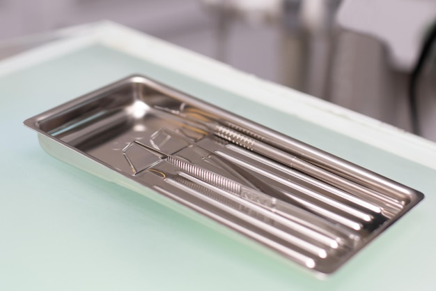 Closeup set of sterile clean instruments of a dentist doctor in a dentist's office