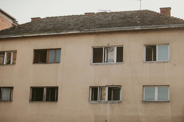 Closeup shot of an abandoned building with broken windows