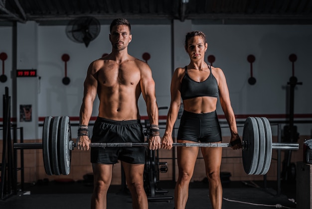 Closeup shot of an athletic male and female in the gym