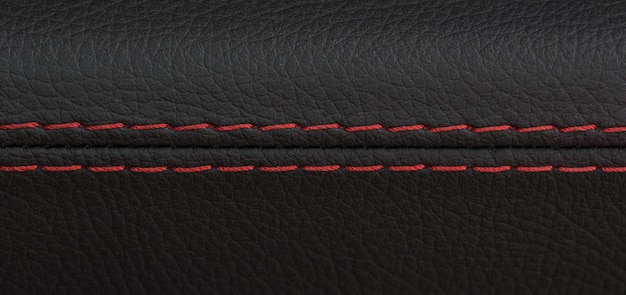 Closeup shot of black leather car seat with red stitchsports luxury car