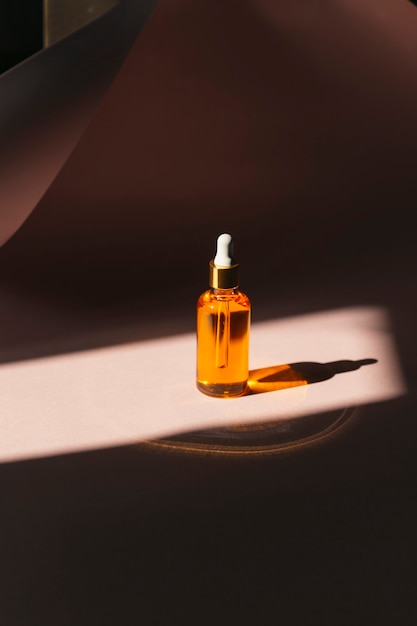 a closeup shot of bottle of essential oil with dropper