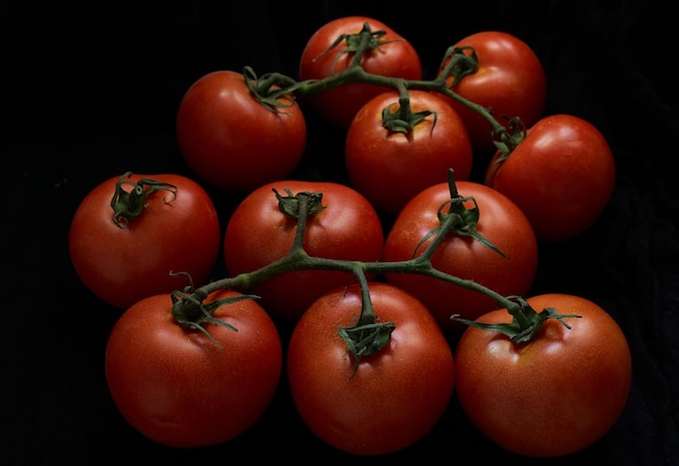Closeup shot of cherry tomatoes isolated on a black background