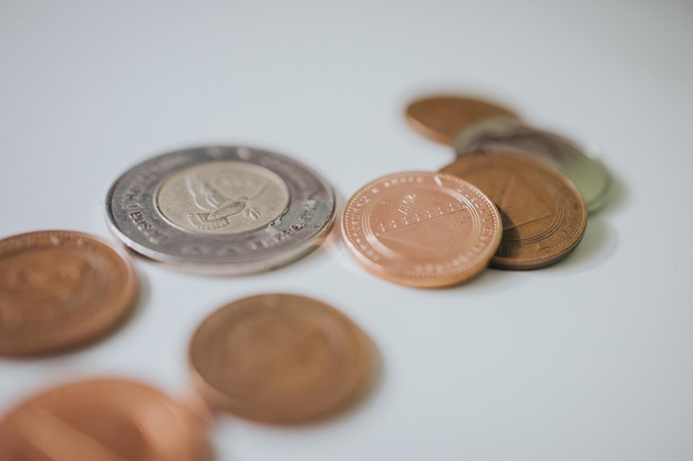 Photo closeup shot of coins on the white background