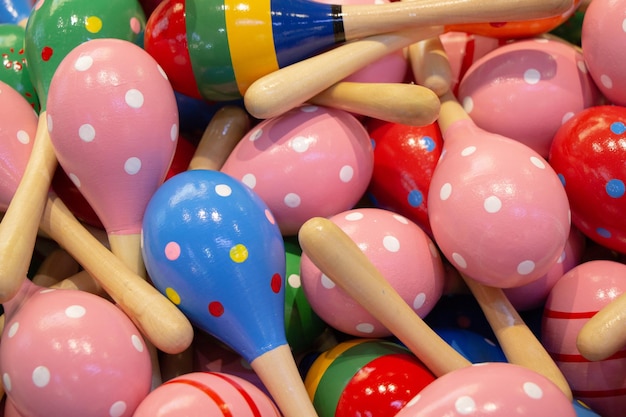 Closeup shot of colorful wooden maraca rattles shaker toy