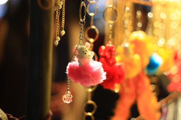 Closeup shot of cute hanging keychains at a market