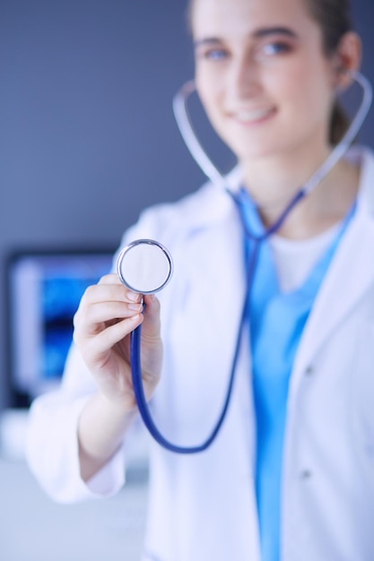 Closeup shot of doctor's hands holding stethoscope at clinic